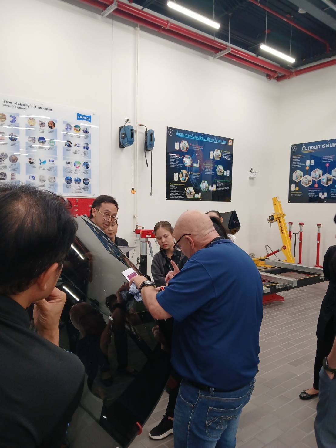 Hands-on windscreen repair discussion with the Mercedes-Benz Thailand service team