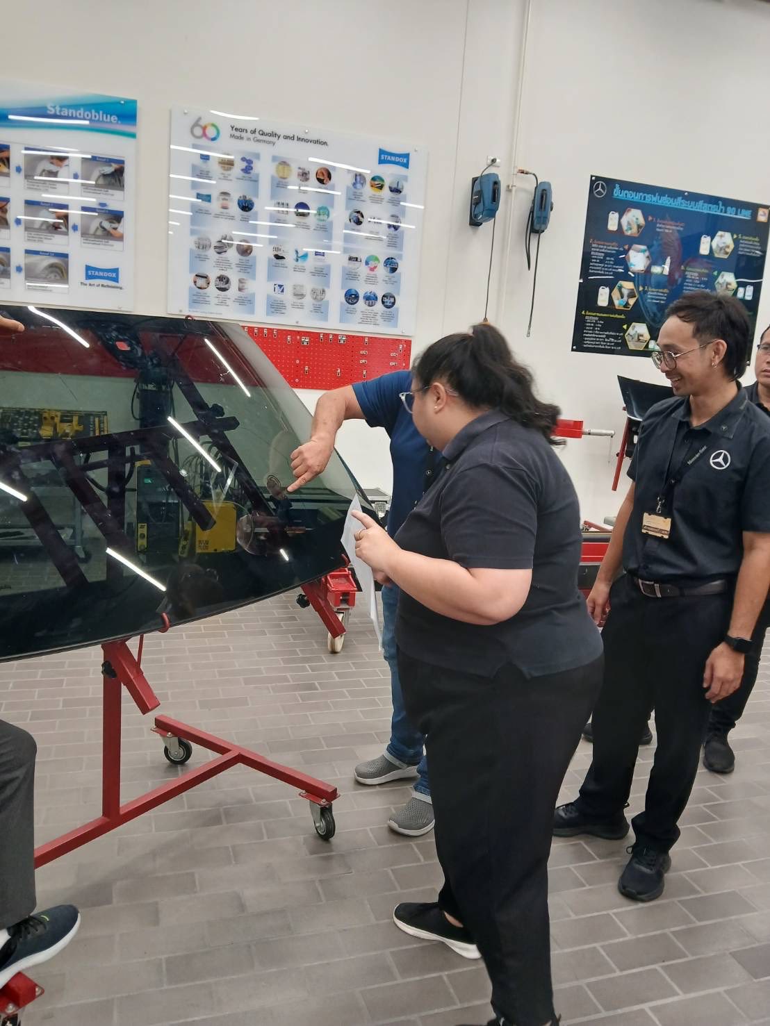 M&H Group and Mercedes-Benz Thailand team reviewing windscreen repair workflow